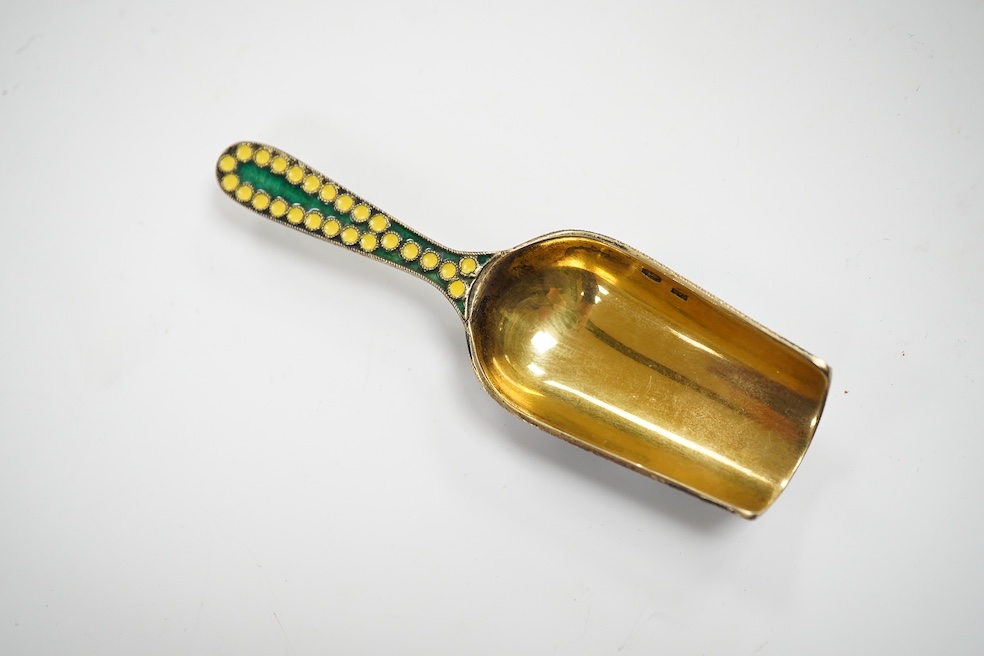 A Soviet Union 916 gilt white metal and enamel caddy spoon, 91mm and vodka tot, 44mm. Condition - good
